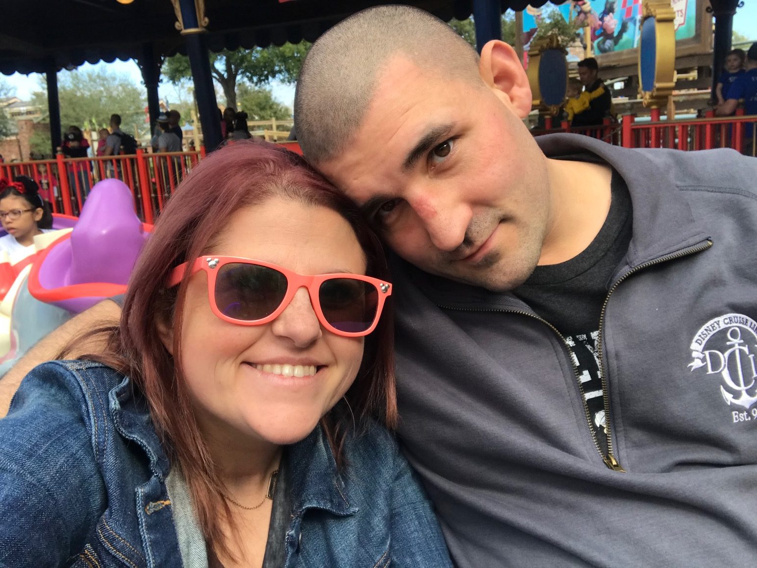 Husband and wife riding Dumbo